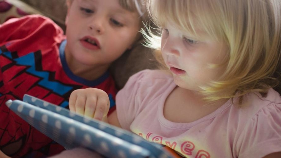 children playing on tablet