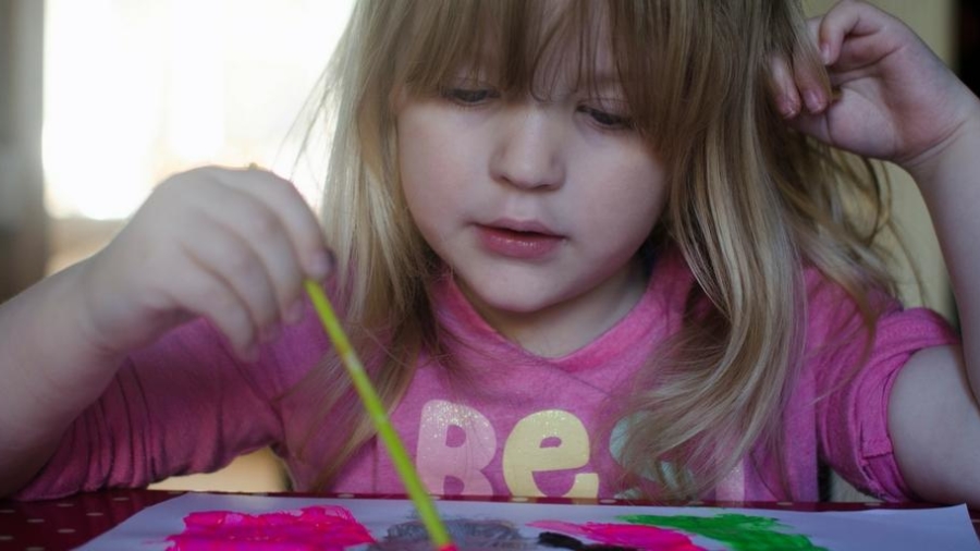 young girl painting